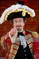 Actor John Neville in costume as Baron Munchausen and pointing on the ...