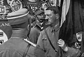 Grasping the "Blood Flag" in his hand, Adolf Hitler moves through the ...