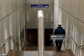 A persons walks down into the Phil Alperson Way, a tunnel that goes ...
