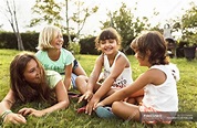 Group of four little girls having fun outdoors — children, childhood ...