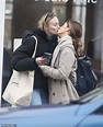 Sophie Turner enjoys a smoke and a smooch with her friend after an al ...