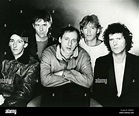 DIRE STRAITS Promotional photo in 1984 from left Terry Williams Stock ...