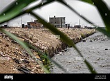 Waste and garbage are seen on the banks of Río Chillón, a heavily ...