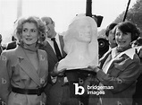 Image of Actress Catherine Deneuve Posing With The Bust of Marianne (Female