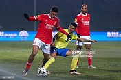 Antony Alves Santos of FC Arouca competes for the ball with Alexander ...