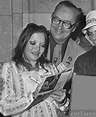 Catharine Lorre giving autographs.