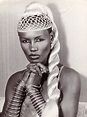 young Grace Jones poses for a portrait in 1977 wearing a blonde wig ...