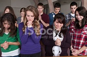 Group Of Praying Teenagers, Heads Bowed Stock Photo | Royalty-Free ...