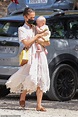 Alicia Vikander cradles a baby during holiday with husband Michael ...