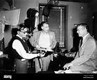 Director GEORGE SEATON and CLARK GABLE on set candid during filming of ...