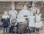 John Joyce aged 2 sitting on a stool to the left of his mother Catherine