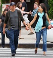 Woody Harrelson grins as he walks hand in hand with his wife Laura ...