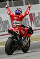 Loris Capirossi celebrates taking Ducati`s first ever MotoGP victory ...