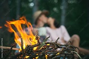 Camp fire in the night. Sensual couple. Having sex. Kissing couple ...
