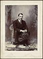 Studio portrait of U. S. Consul Adelbert S. Hay seated holding hat and ...