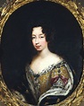 a portrait of a woman in a gold frame