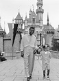 Nat King Cole with his son Nat Kelly Cole in Disneyland, California ...