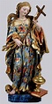 a statue of the virgin mary holding a cross