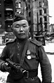A Red Army soldier with his PPSh-41 in Berlin in 1945 : r/MilitaryHistory