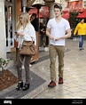 Lucas Till and his girlfriend walk through The Grove West Hollywood ...