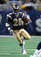 Hall of Fame running back Marshall Faulk advances the ball downfield ...