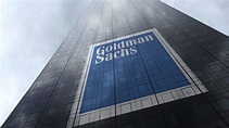 The Goldman Sachs Group logo on a skyscraper facade reflecting clouds ...