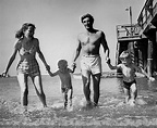 Robert Mitchum, his wife Dorothy and their two sons enjoy the beach ...