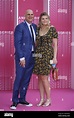 Harlan Coben and his daughter Charlotte are posing along the pink ...