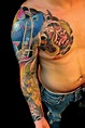 Black Ink Chip Tattoo On Man Left Sleeve