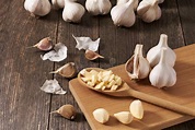 Chopped Garlic in a Wooden Spoon on the Table Stock Photo - Image of ...
