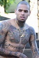 Chris Brown shows off tattooed chest as he goes topless on set of new ...