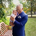 Prince Charles, Prince of Wales holds Prince Louis of Cambridge after a ...