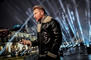 Photos: DJ David Guetta records hour-long NYE show in front of Louvre ...