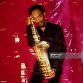 Portrait of American jazz musician Sam Rivers as he poses against a ...