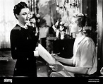 JOAN FONTAINE and JUDITH ANDERSON in REBECCA (1940), directed by ALFRED ...