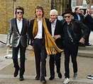 [ID] What is Keith Richards wearing on his right foot? : Sneakers