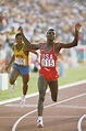 LOS ANGELES, CA - AUG 8 1984: Carl Lewis of the USA raises his arms ...