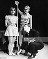 Director and producer Gene Persson and actress Debbie Bowen measuring ...
