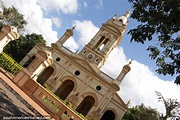 The impressive church in the town of Itaugua, arches and tower. Photo ...