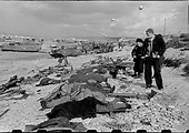 Robert Capa '44 (June) Omaha Beach. French fishermen looking at the ...
