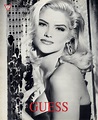 Anna Nicole Smith for Guess Jeans ad 1992 holds bead room divider
