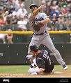 Los Angeles Dodgers second baseman Aaron Miles completes a double play ...