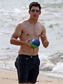 The Men Of Hollywood: Nick Jonas Shirtless Holding a Ball At The Beach