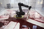 A Large Robotic Arm Futilely Tries to Clean a Blood Red Mess in the Art ...
