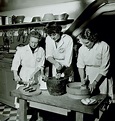 Simone Beck, Julia Child, and Louisette Bertholle cooking fish at L ...