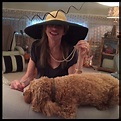 Carly at home wearing a hat and pearls with her dog, Aja. | Carly simon ...