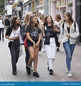 A Young Teenagers Girls Walks Along Carnaby Street. Carnaby Street is ...