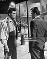 Elvis Presley meeting Vic Morrow outside in a scene from the film ...