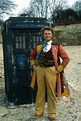 The Sixth Doctor (Colin Baker) with the TARDIS. | Doctor who, Doctor ...