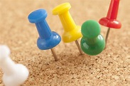 Free Image of Close up Colored Pins on Cork Board | Freebie.Photography